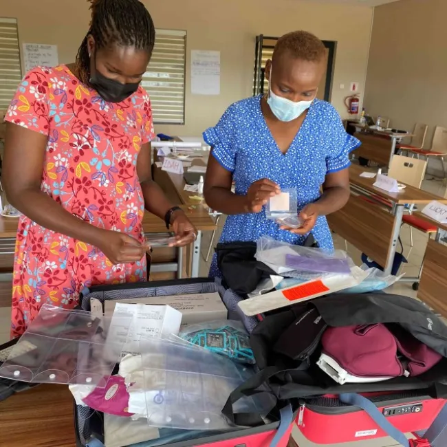 the faciltators purity and edna checking the training materials fp pilot malawi march 2022 kopi.jpg